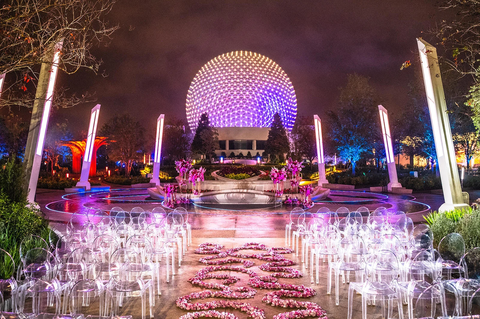 Wedding ceremony with Spaceship Earth in the background at EPCOT