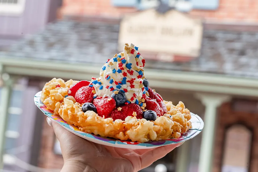 Traditional cake with red fruit, ice cream and granolas with the colors of the American flag to celebrate the Fourth of July holiday at Walt Disney World