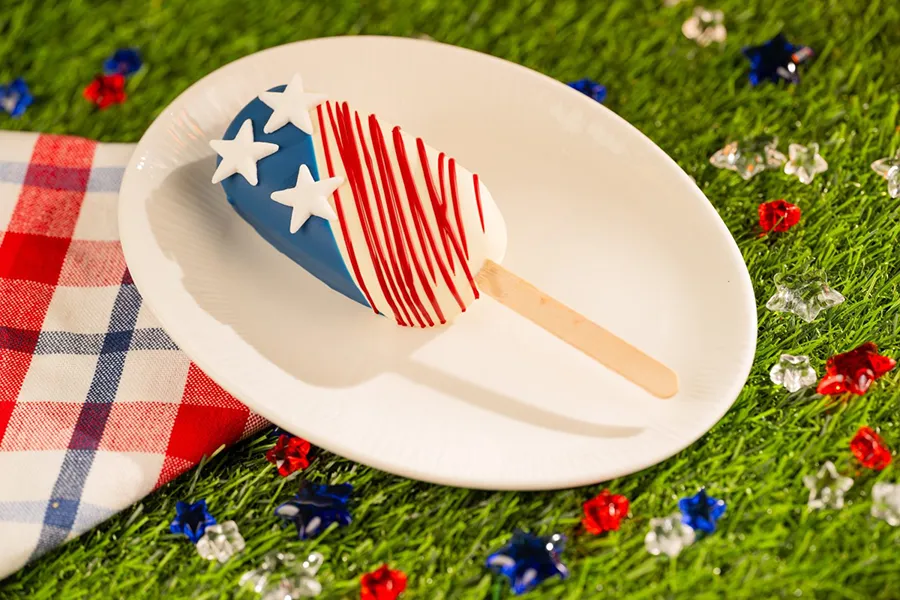 Cake on the stick with the colors of the American flag to celebrate the Fourth of July holiday at Disney Springs